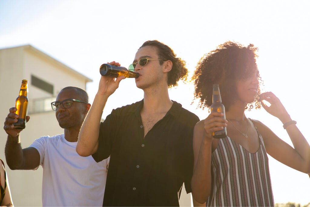 Group drinking beet outdoors