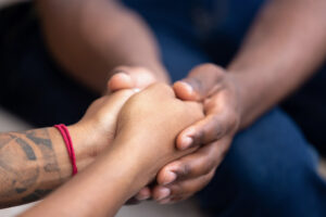 Close up of hands being held